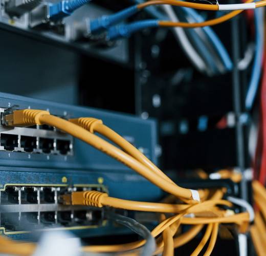 Close up view of internet equipment and cables in the server room.